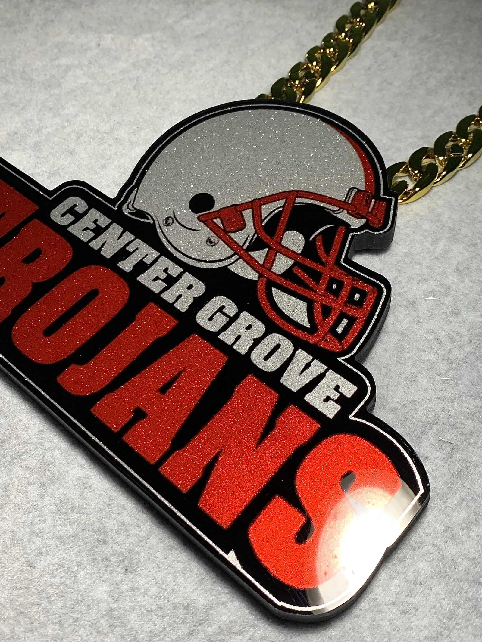 Center Grove Trojans football pendant product shot.